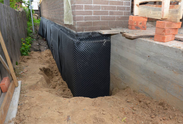 Happy homeowners after waterproofing job in Mount Olive